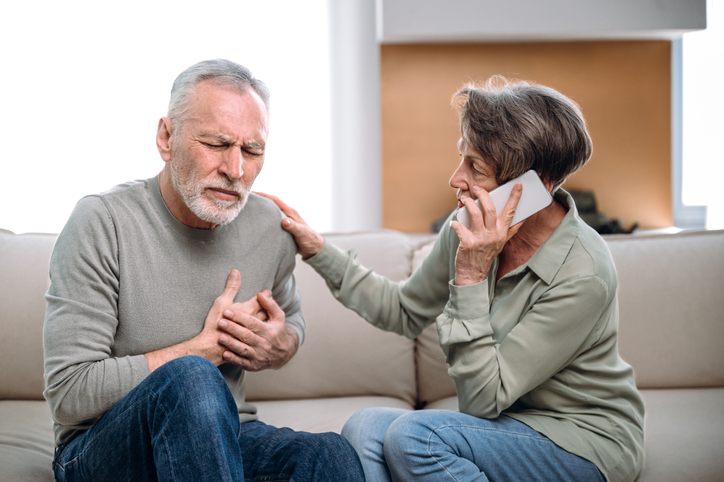 Woman calling emergency ambulance worried about old husband at home